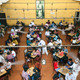 Customers sit beneath a portrait of Rabindranath Tagore in the Indian Coffee House, Kolkata, India.